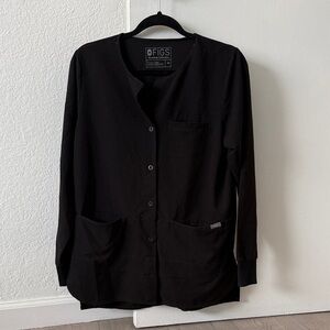 XS Figs Black Button-Up Scrub Jacket -Pre-loved. Has minor stains.